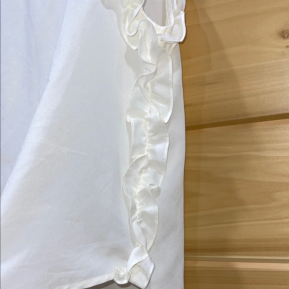 Chic Ivory Ruffle Sleeveless Blouse - Picture 2 of 4